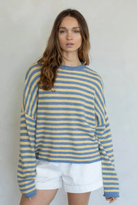Cozy long-sleeved striped piper pullover sweater in soft blue and pale yellow perfect for casual wear