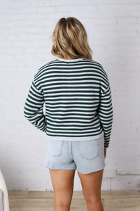A cozy supply dover button front cardigan in dark green and white knit fabric with horizontal stripes and long sleeves