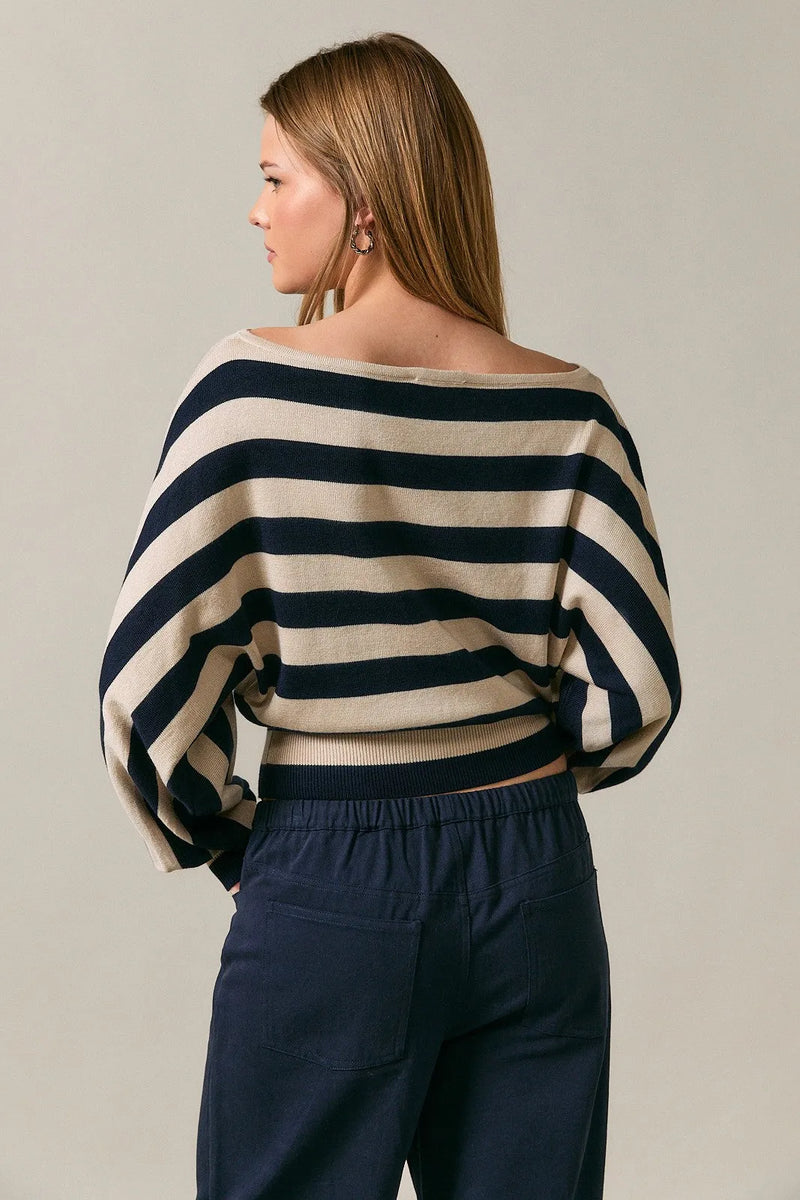 Boat neck dolman sweater top with bold navy and cream stripes featuring wide flowing dolman sleeves