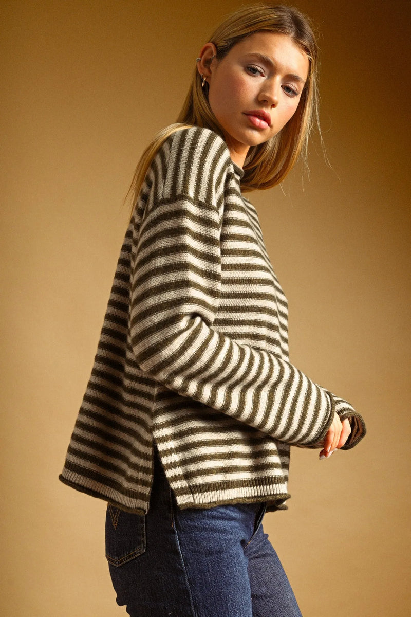 Cozy oversized sweater with bold olive green and cream striped pattern rolled neck detail for casual wear