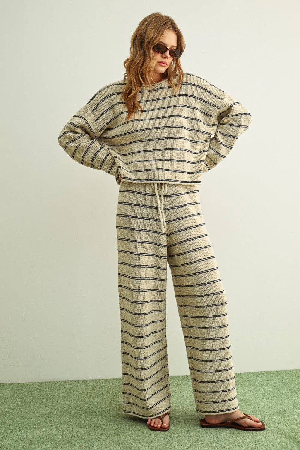 A cozy ribbed knit striped pattern long sleeve sweater set in soft beige and dark gray for comfortable wear