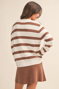 A cozy ribbed knit striped round neck relaxed sweater in cream and warm brown perfect for casual wear
