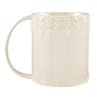 Cream-colored ceramic embossed holiday mug with snowflake and leaf patterns for festive use