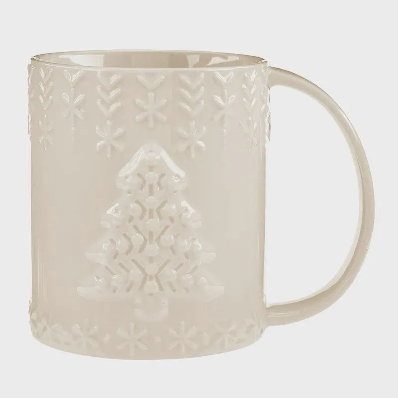 Cream-colored ceramic embossed holiday mug featuring a Christmas tree design surrounded by snowflake patterns