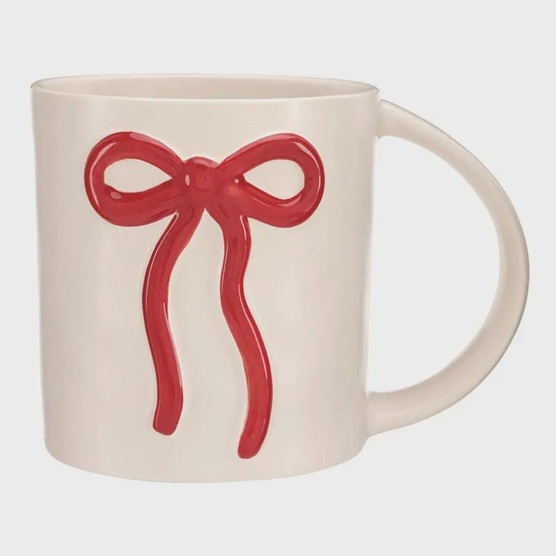 Cream ceramic wide handle bow mug featuring a glossy red bow design for comfortable grip and stylish use