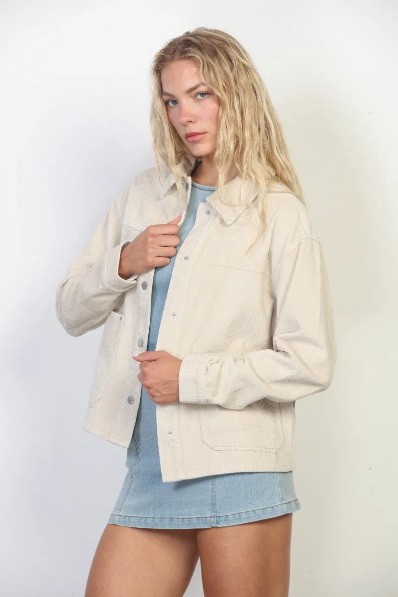 Cream-colored garment washed corduroy chore jacket with button closures and flap pockets in washed corduroy fabric