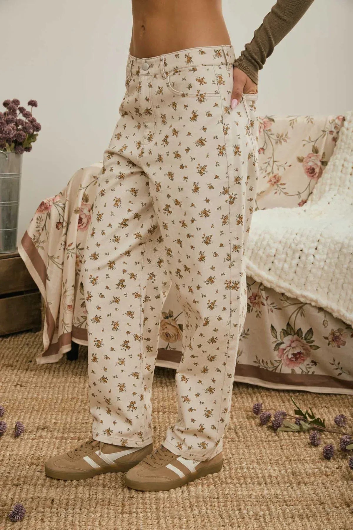 Cream-colored wide-leg floral denim pattern jeans with soft flowing fabric and subtle brown flower details
