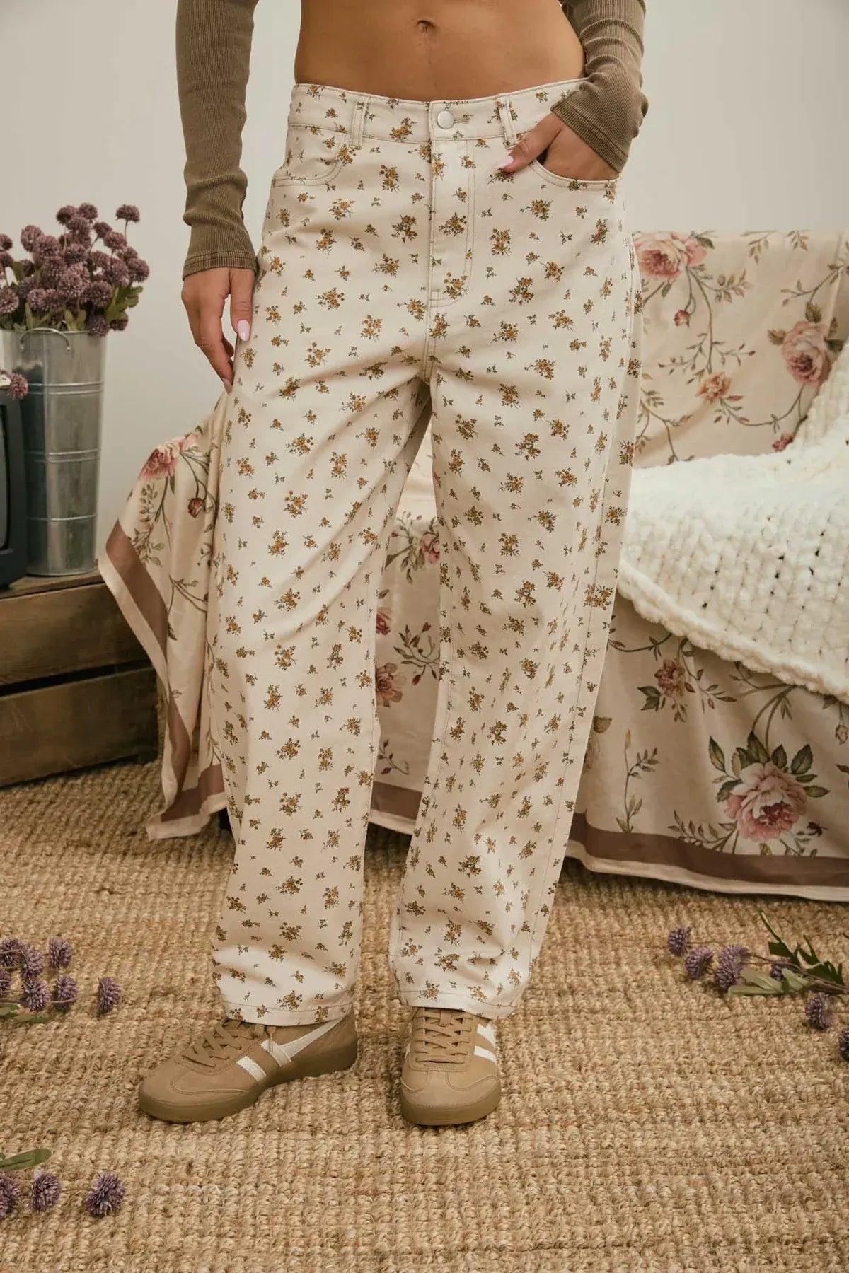 Cream-colored high-waisted denim pattern jeans featuring a delicate brown floral denim pattern design