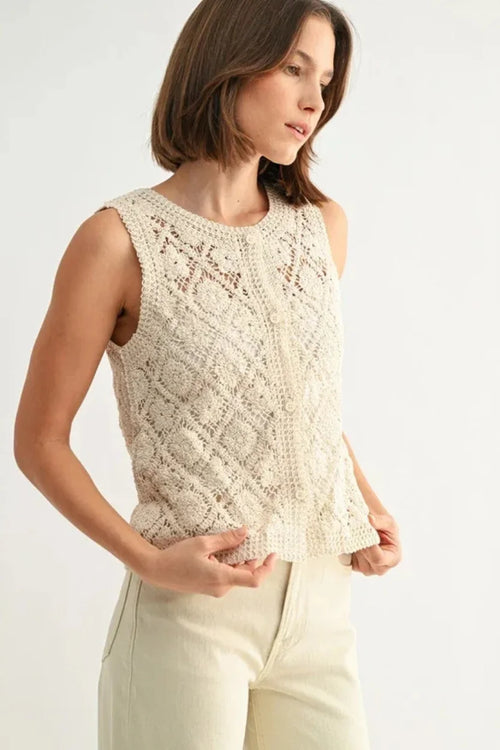 Cream crochet sleeveless button down top with lace pattern