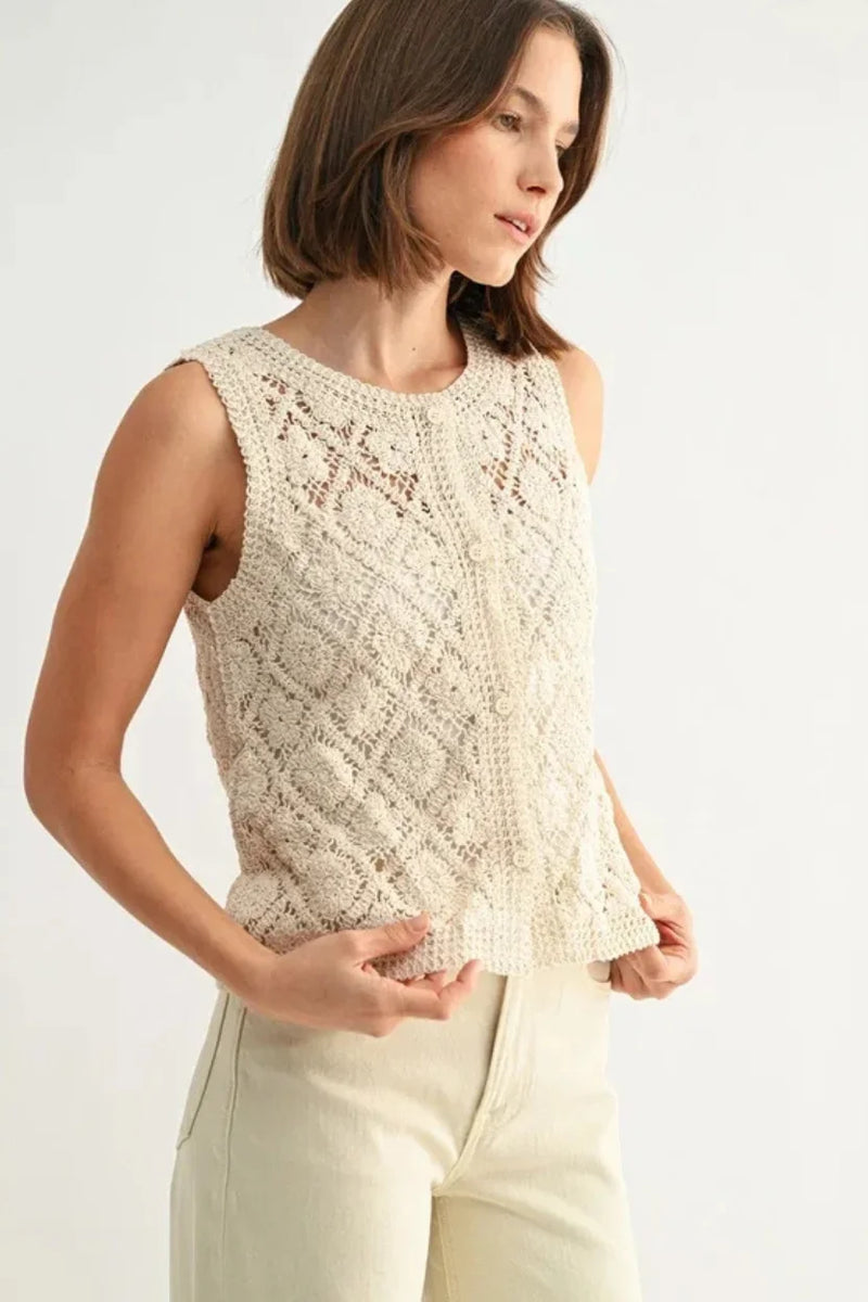 Cream crochet sleeveless button down top with lace pattern
