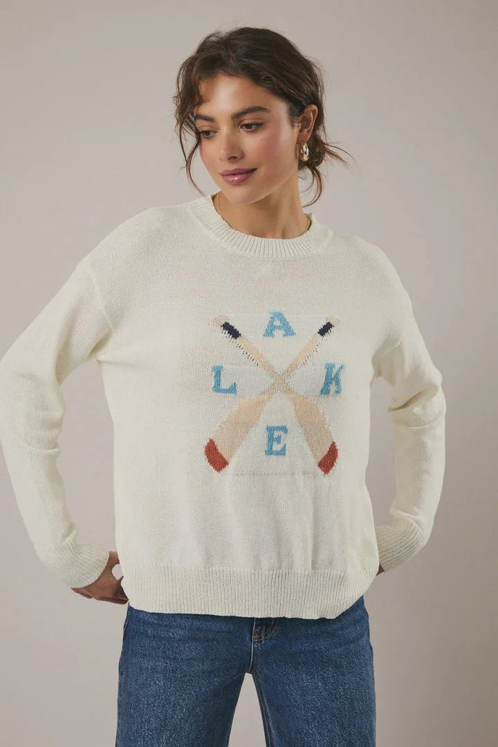Cream-colored Lake round neck long sleeve sweater with crossed paddles graphic