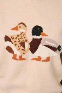 Cream-colored knit sweater featuring a mallard duck graphic with one duck in leopard print and one in natural colors
