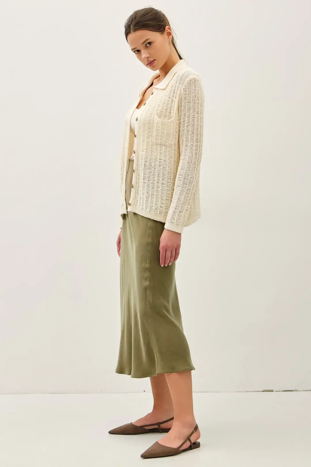Breezy textured knit cream cardigan with button closure