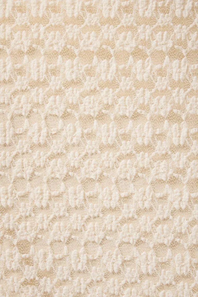 Cream-colored lace mid rise midi skirt with delicate floral pattern and midi half lined design for elegant wear