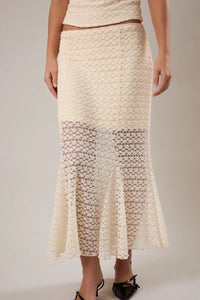 Cream-colored mid rise midi half lined skirt with textured crochet lace pattern and flared hem for elegant wear