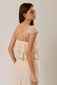 Cream-colored lace trim layered off-shoulder crop top with ruffled layers and delicate spaghetti straps
