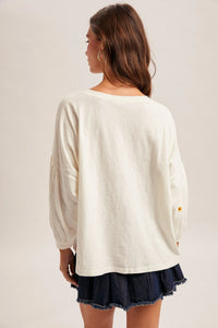 Daisy embroidered long sleeve top, cream loose fit with puff sleeves