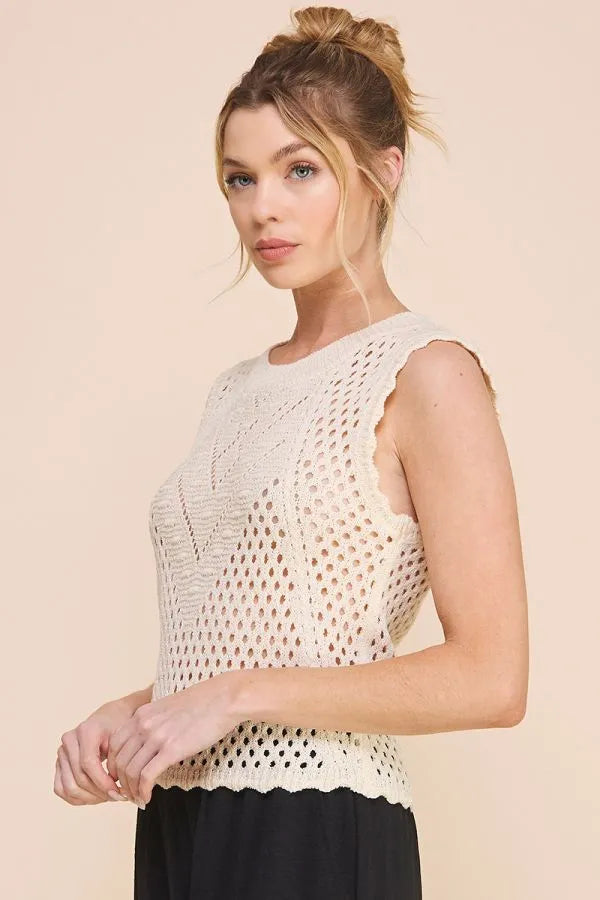 Cream-colored scallop pointelle round sleeveless top with open-knit texture and scalloped edges