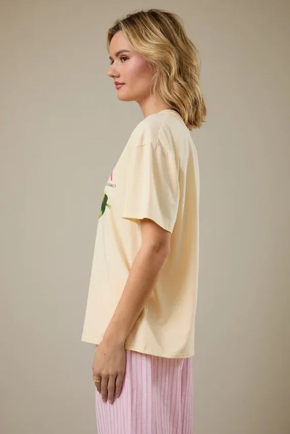 Cream-colored oversized papaya crew neck graphic t-shirt with a subtle print on the front in soft fabric