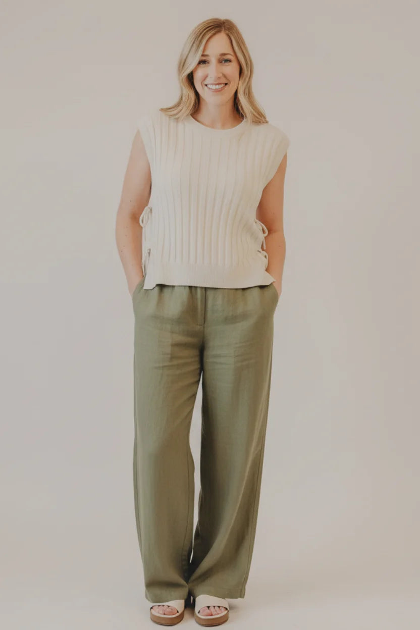 Cream-colored ribbed sweater vest with side ties by Thread & Supply