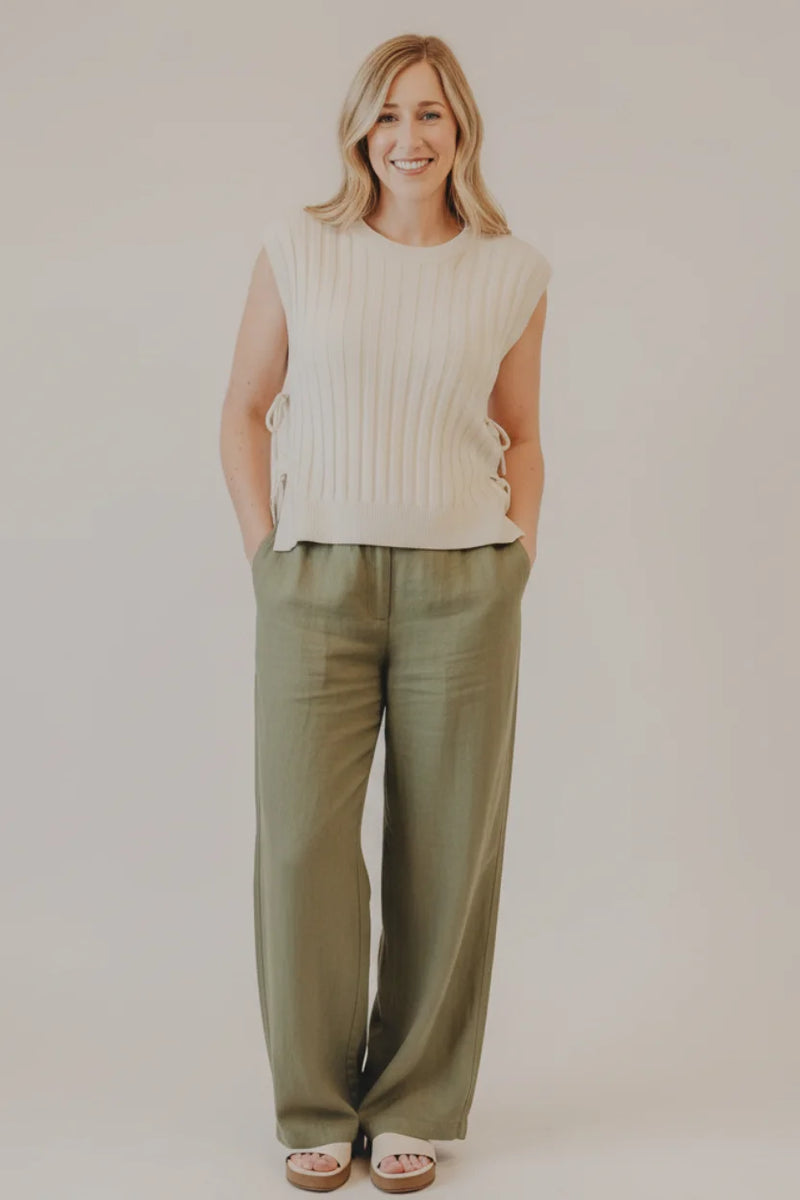 Cream-colored ribbed sweater vest with side ties by Thread & Supply