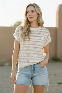 Cream-colored knit striped short sleeve top with openwork detailing
