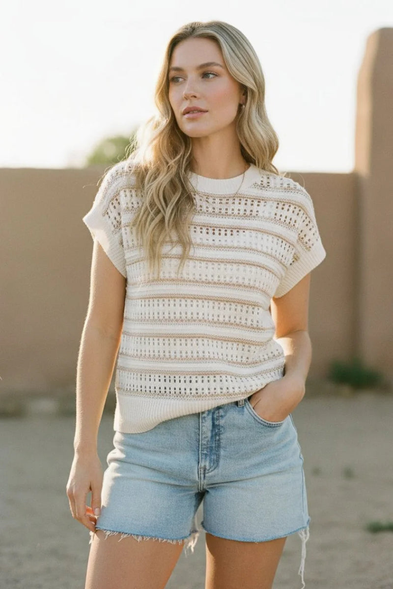 Cream-colored knit striped short sleeve top with openwork detailing