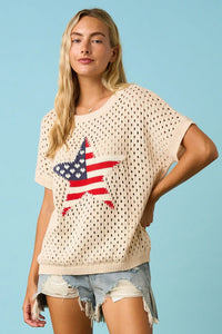Cream-colored short-sleeved usa star patch open knit sweater top with perforated texture and american flag star design