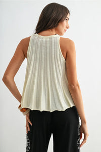 Cream-colored flared hem sleeveless knit top with vertical pleats and delicate openwork pattern