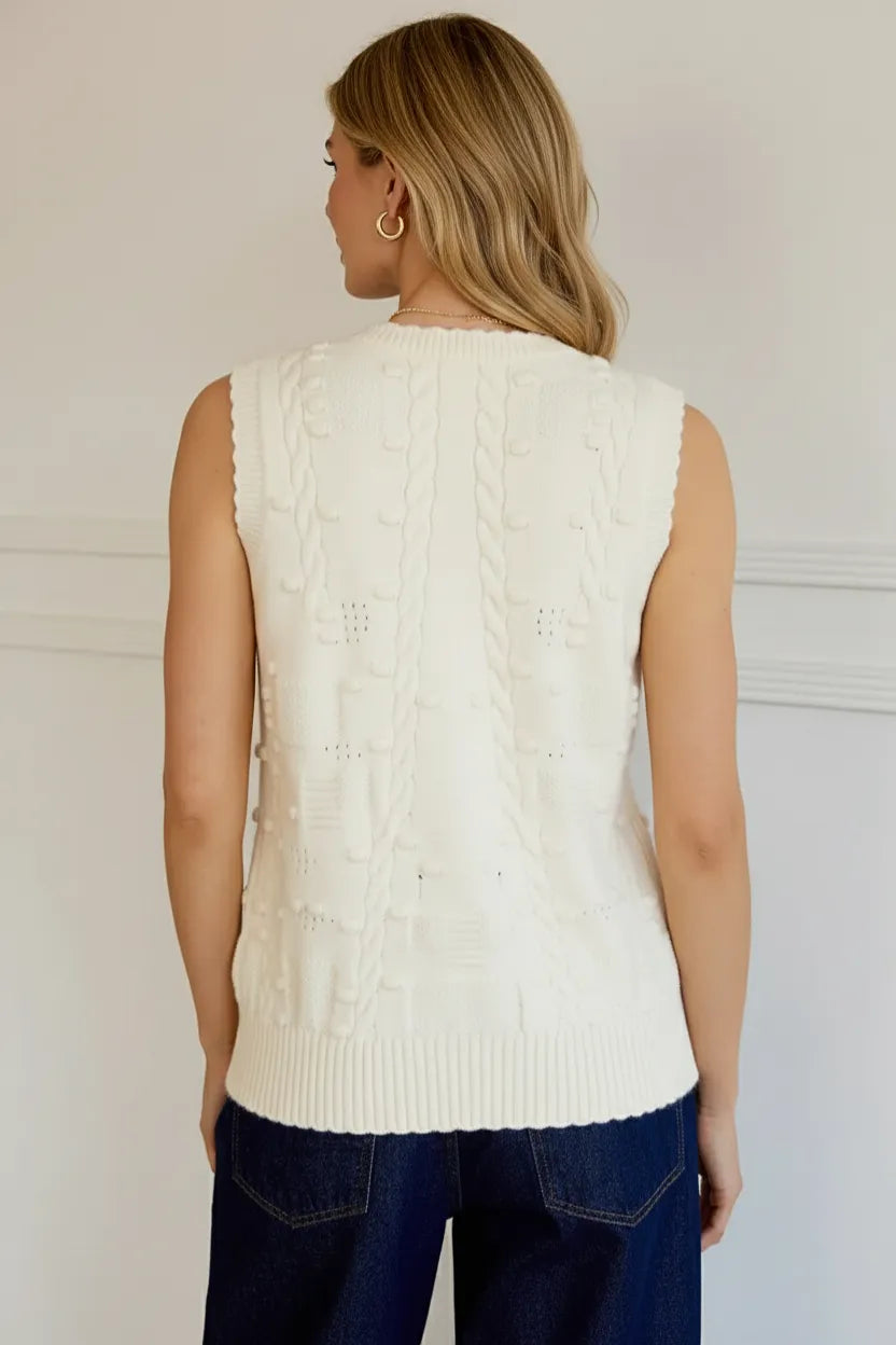 Cream cable knit sleeveless cardigan vest with intricate patterns
