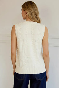 Cream cable knit sleeveless cardigan vest with intricate patterns