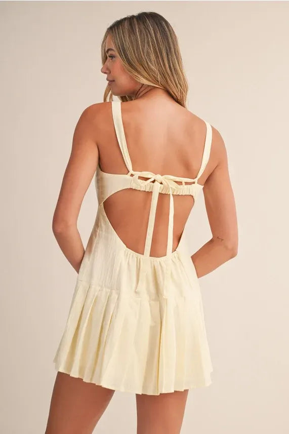 Cream-colored cotton mini dress with shirring bra detail sleeveless ruched back and tied straps bra cotton mini design