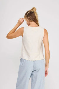 Cream-colored sleeveless linen button collar textured top with a simple relaxed fit perfect for casual wear
