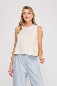 Cream-colored linen button collar textured sleeveless top with a subtle front zipper detail for elegant wear
