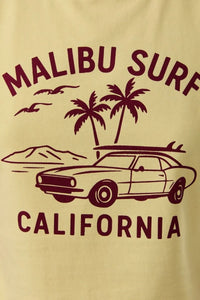 A cream-colored baby tee with a maroon malibu surf graphic of a classic car, surfboards, and palm trees