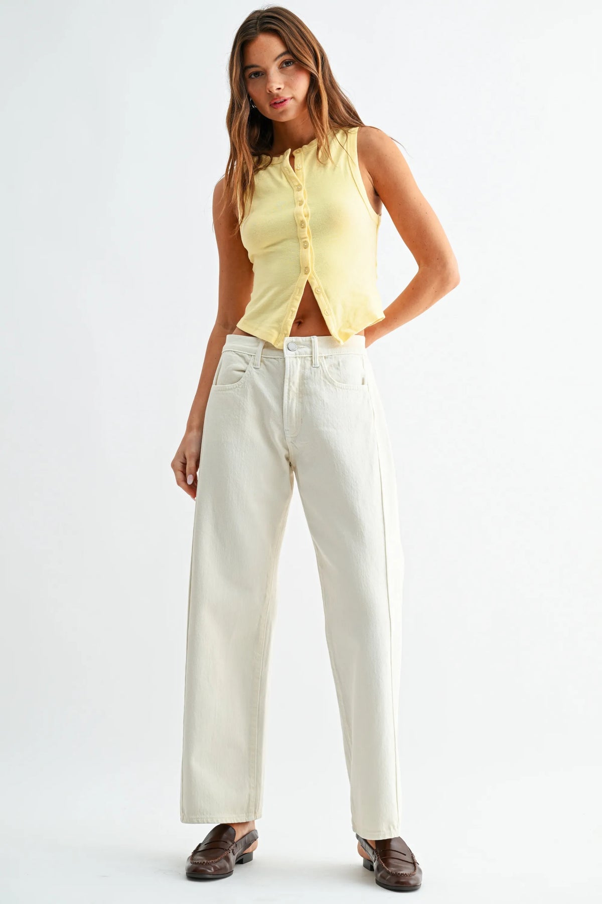 Cream-colored wide-leg denim jeans with a high rise stretch slight barrel twist and a clean straight-cut silhouette