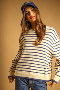 Cream and navy blue striped long sleeve knit sweater with ribbed cuffs and hem for casual wear