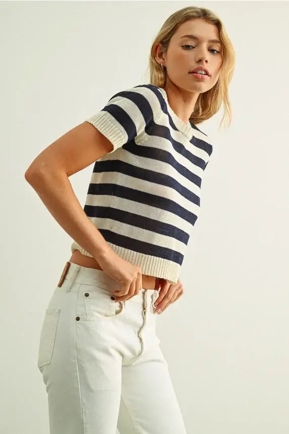 A cropped short sleeve striped knitted short top in bold navy and off-white horizontal stripes
