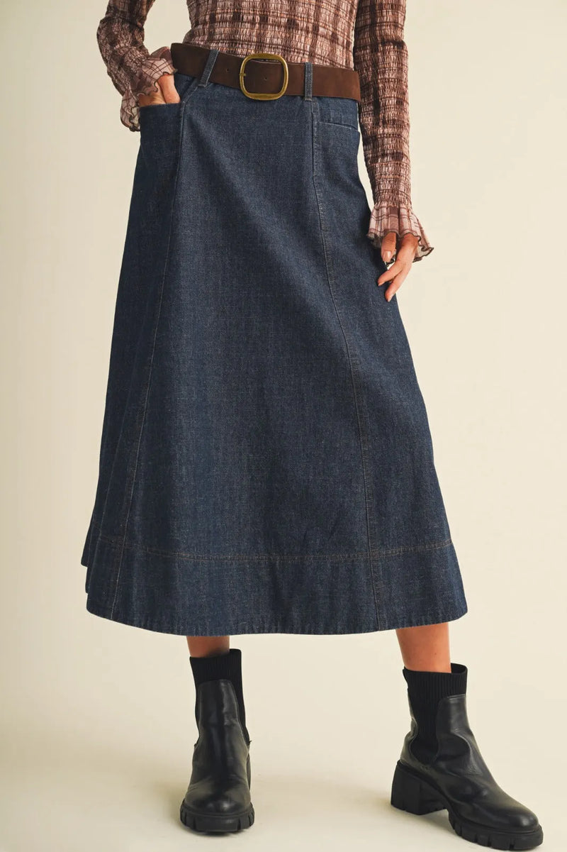 A dark blue denim belted indigo maxi skirt with a straight cut and visible stitching details