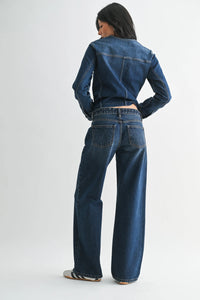 Dark blue denim jacket with classic stitching and cropped fit paired with low rise baggy wide leg denim jeans