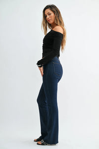 Dark blue high-waisted slim bootcut jeans with scissor cut featuring classic denim texture and subtle thigh fading