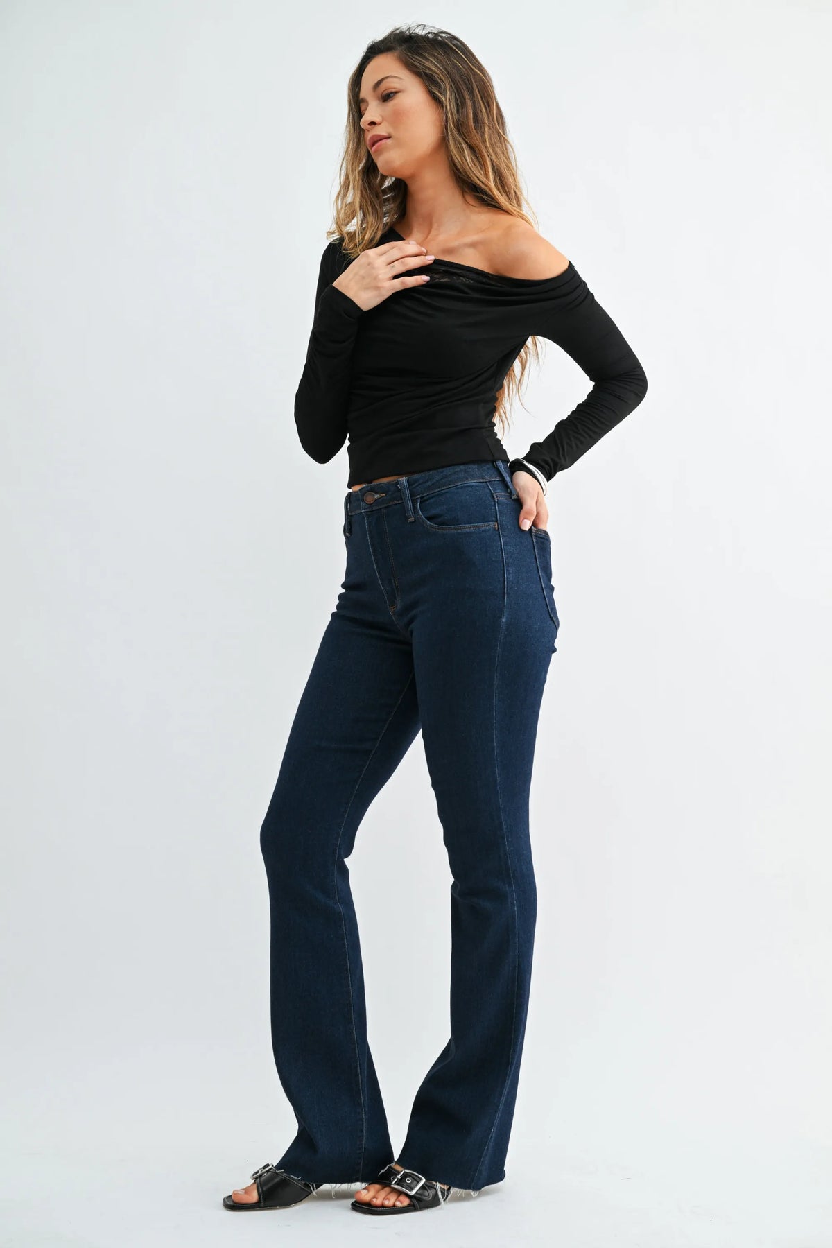 Dark blue high-waisted slim bootcut jeans in denim with flared legs and scissor cut detailing for ladies