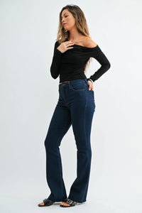 Dark blue high-waisted slim bootcut jeans in denim with flared legs and scissor cut detailing for ladies
