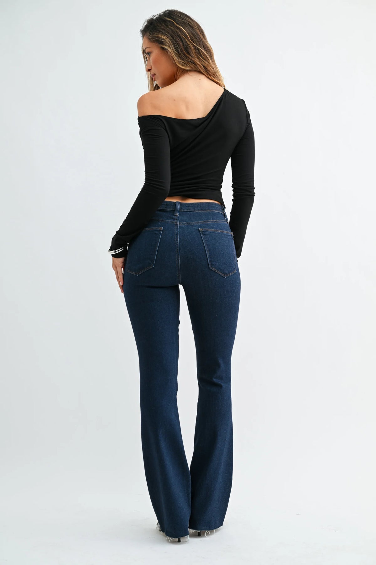 Dark blue high-waisted slim bootcut jeans with scissor cut and classic five-pocket denim design for ladies