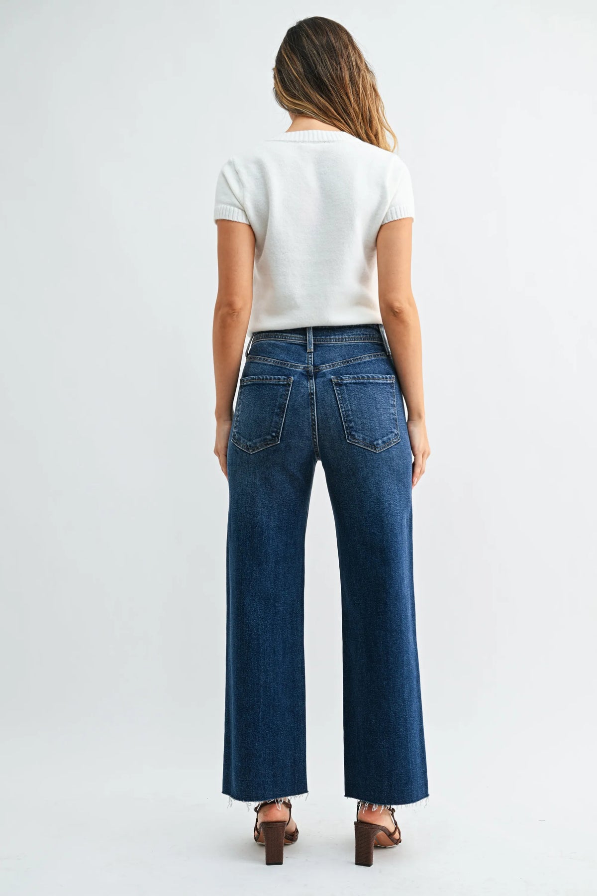 Dark blue nautical wide leg denim jeans with a frayed hem in high rise wide leg denim style