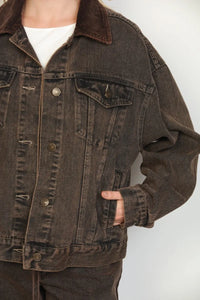 Dark brown oversized trucker denim jacket with a contrasting corduroy collar in a durable trucker denim fabric