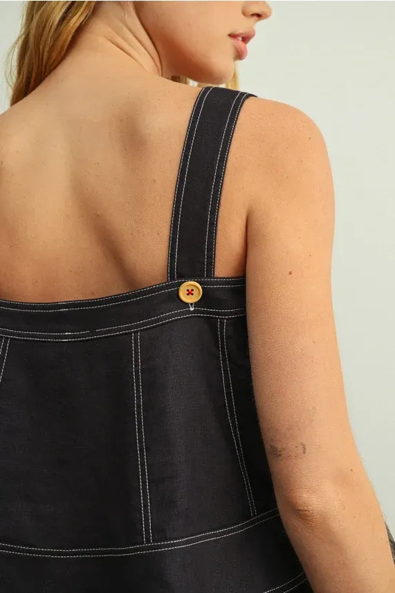 Dark denim stitch detailed sleeveless top with white stitching and wooden button on shoulder strap