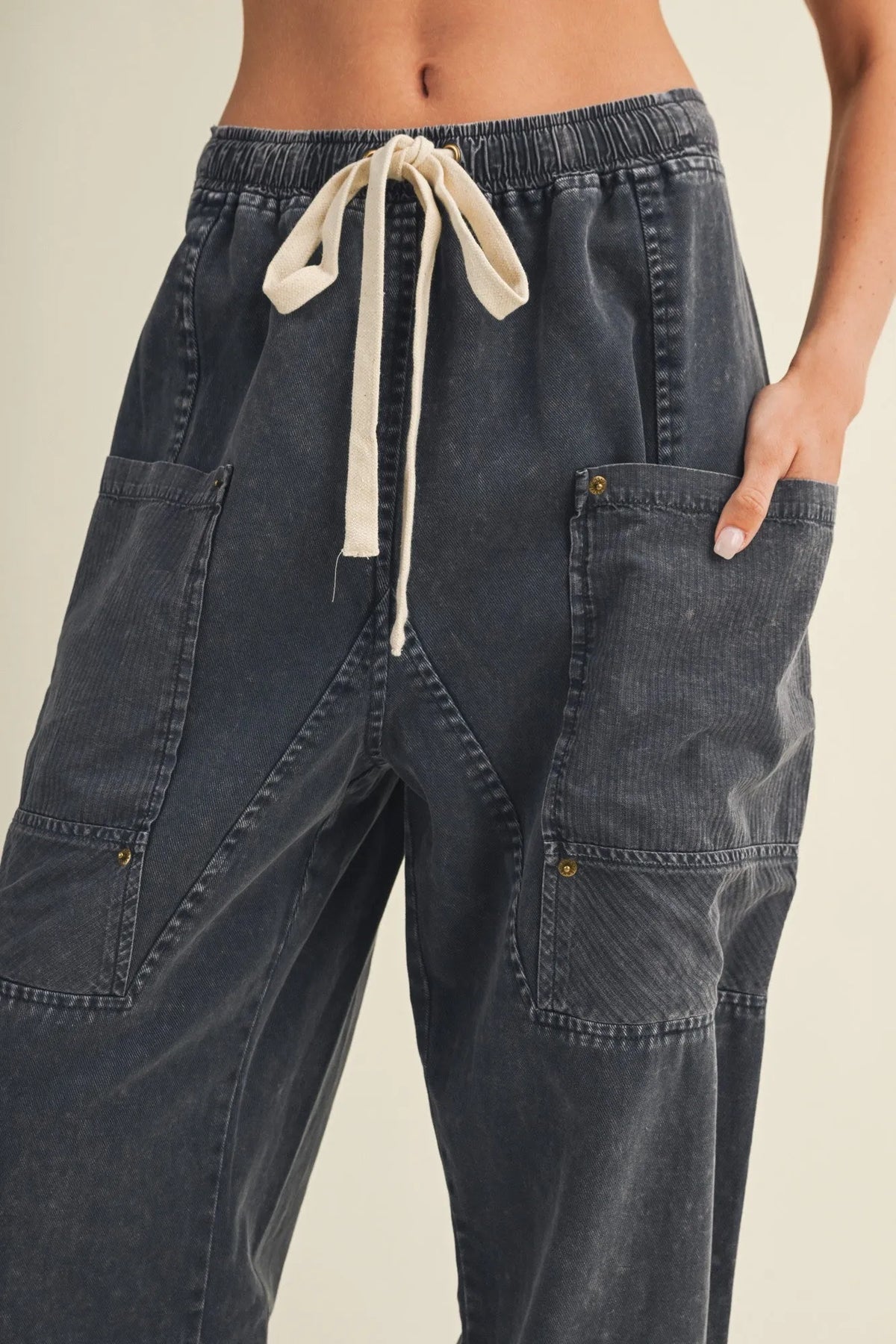 Dark gray corduroy drawstring waist wide leg utility pants with multiple pockets for functional style
