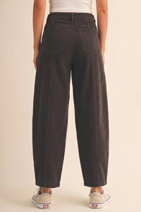 Dark gray mid rise corduroy barrel pants with vertical stripes and two back pockets shown from the back side