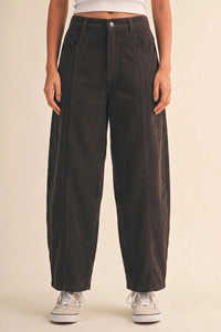 Dark gray mid rise corduroy barrel pants featuring wide-leg design and subtle vertical ribbing in corduroy fabric